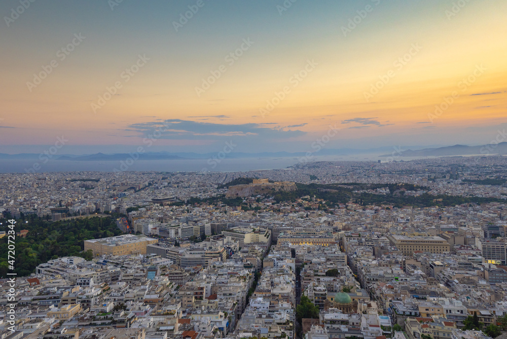 Evening sunset view from Lycabettus hill of the ancient Parthenon on Acropolis Hill  in central Athens, Greece