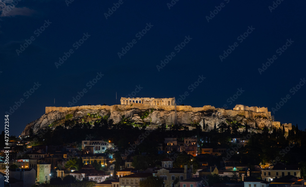 Aerial panoramic view of Monastiraki square and the ancient Parthenon on Acropolis hill in Athens, Greece.