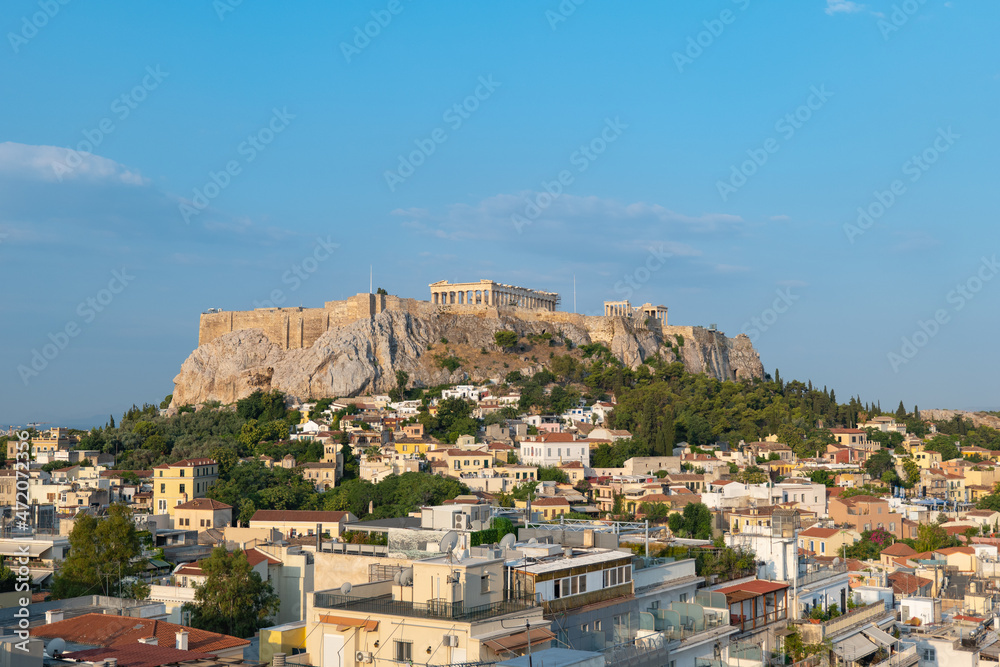 Parthenon Temple at Acropolis hill, in Athen, Greece. The famous old Acropolis is a top landmark of Athens. Scenic view of remains of ancient Athens.
