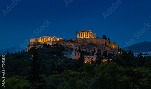 Evening view of the Parthenon Temple at Acropolis hill, in Athen, Greece. The famous old Acropolis is a top landmark of Athens. Scenic view of remains of ancient Athens.