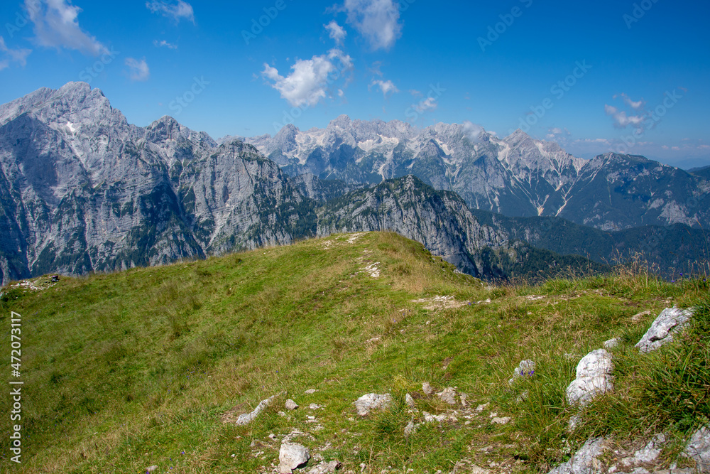 View from Debela Peč. Peak in the Julian Alps, Slovenia, august 2020. Horizontal, color photo. With view to hill Triglav.