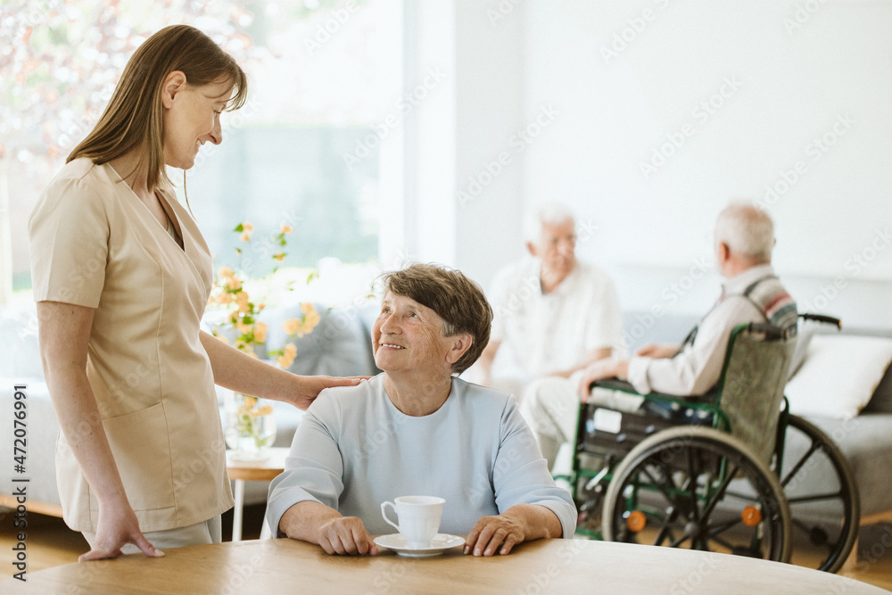 Happy senior woman and helpful caregiver, nursing home concept photos Happy senior woman and helpful caregiver, nursing home concept photos