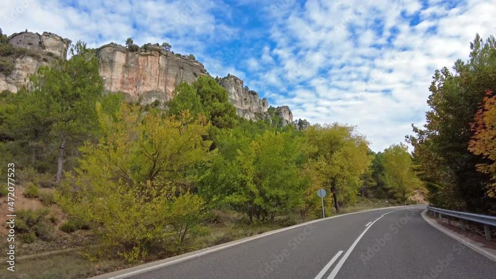 Driving along the karstic cliffs in large lagoon of Tobar at Hoz de Beteta, Cuenca, Castilla la Mancha, Spain, Landscapes of the mountain range of Cuenca Driving along the karstic cliffs in large lagoon of Tobar at Hoz de Beteta, Cuenca, Castilla la Mancha, Spain, Landscapes of the mountain range of Cuenca