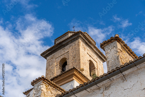 iew from below to a stone steeple against the blue sky