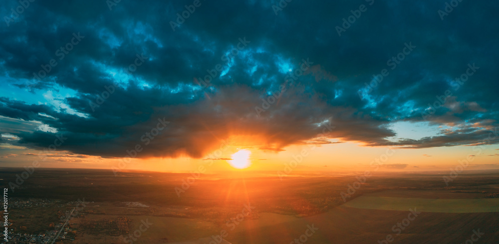 Aerial View Of Sunshine In Sunrise Bright Dramatic Sky. Scenic Colorful Sky At Dawn. Sunset Sky Above Autumn Field And Meadow, Forest Landscape In Evening. Top View From High Attitude