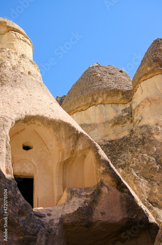 Close-up view of ruins of house in the cave. Picturesque landscape view of ancient cavetown near Goreme in Cappadocia. Popular travel destination in Turkey. UNESCO World Heritage Site photo