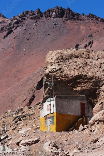  Cement cabin builded under the ledge of a rock in the Andes Mountains on the old border route between Argentina and Chile. 