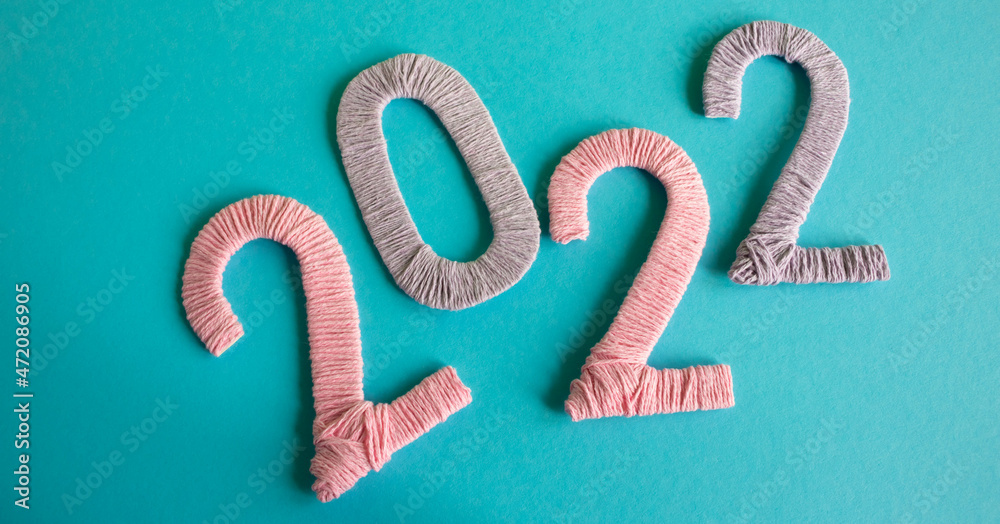 Multicolored numbers 2022 on a blue background. New Year's concept, calendar Multicolored numbers 2022 on a blue background. New Year's concept, calendar