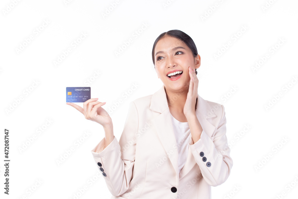 Portrait of a happy young asian woman wearing suit holding bank card, credit card isolated on white background. Business online shopping concept. Portrait of a happy young asian woman wearing suit holding bank card, credit card isolated on white background. Business online shopping concept.