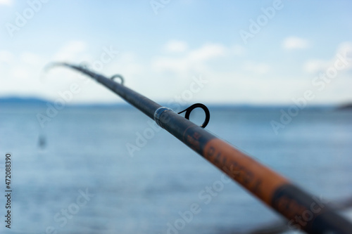 Canvas Sea and clear sky in the foreground in blur fishing rod