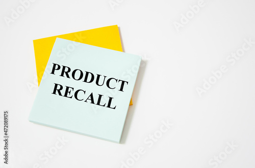 Product Recall text written on a white notepad with colored pencils and a yellow background. word