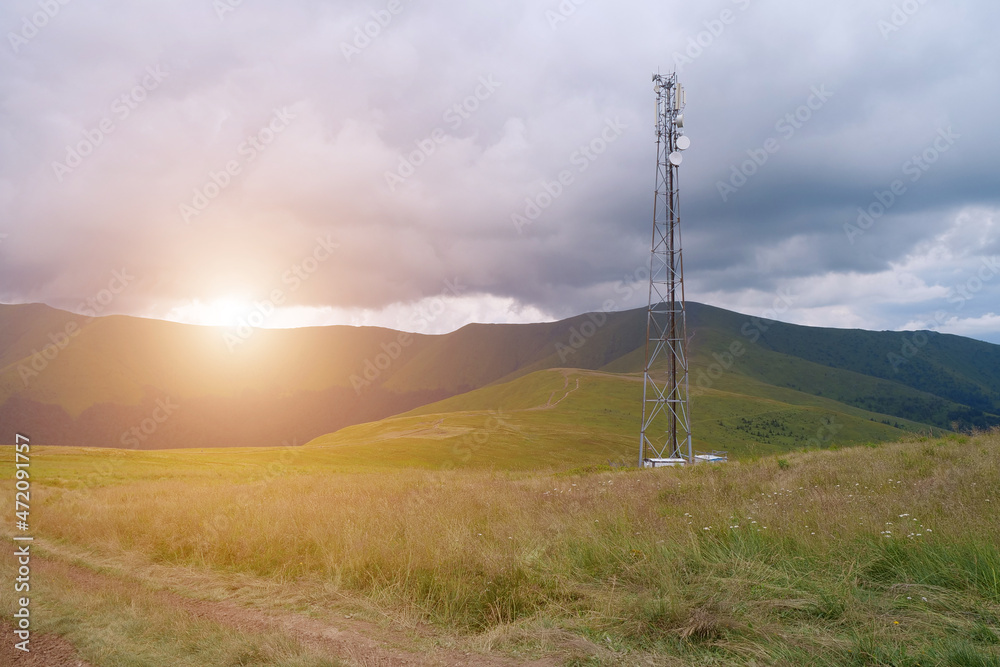 Cell tower and storm clouds in the mountains Cell tower and storm clouds in the mountains