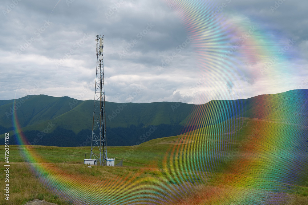 Cell tower and storm clouds in the mountains Cell tower and storm clouds in the mountains