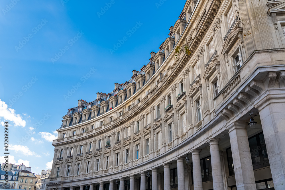 Paris, beautiful curve building, parisian facade rue du Louvre
