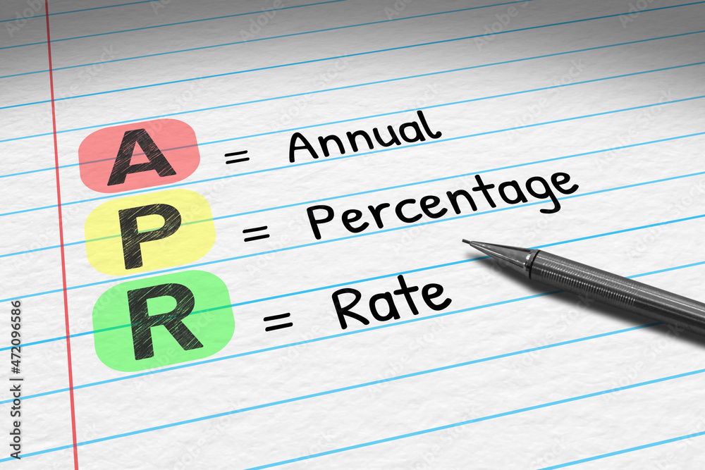 APR - Annual Percentage Rate. Business acronym on note pad.