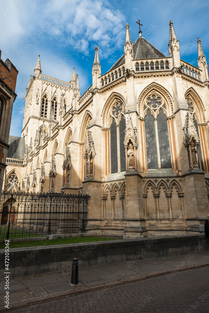 Naklejka premium Historical college building in the city of Cambridge captured on a bright and sunny autumn day, November 2021