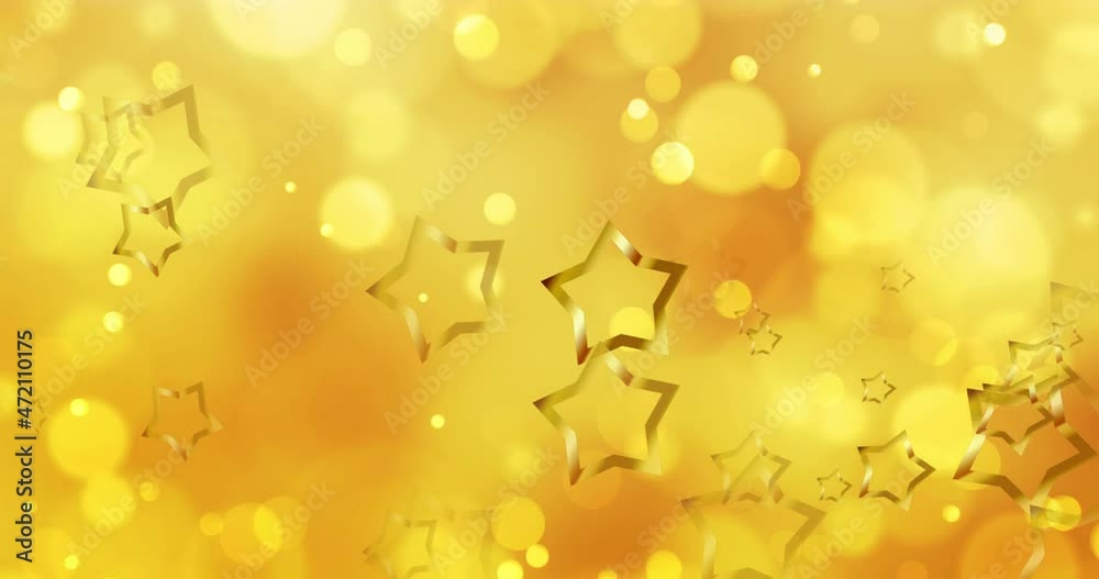 Animation of gold christmas stars and moving yellow bokeh light spots light on orange background Animation of gold christmas stars and moving yellow bokeh light spots light on orange background