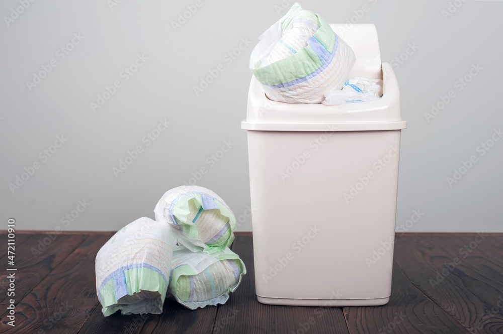Foto de Diapers waste, dirty diapers in garbage pail Disposing of used