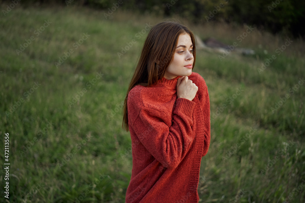 woman outdoors in a red sweater cool nature woman outdoors in a red sweater cool nature