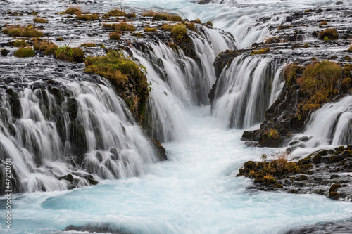 Picturesque waterfall Bruarfoss autumn view. Season changing in southern Highlands of Iceland.