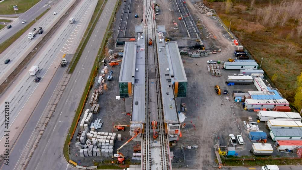 4K camera drone, ultra definition aerial view of the construction site of the new Fairview Station of the REM (Metropolitan Express Network) in Pointe Claire, Montreal. 4K camera drone, ultra definition aerial view of the construction site of the new Fairview Station of the REM (Metropolitan Express Network) in Pointe Claire, Montreal.