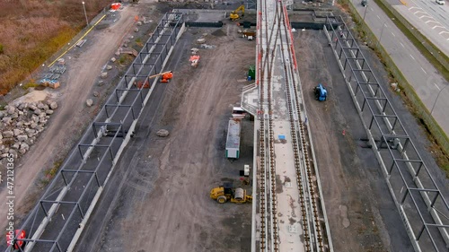 4K camera drone, ultra definition aerial view of the construction site of the new Fairview Station of the REM (Metropolitan Express Network) in Pointe Claire, Montreal, Canada. photo