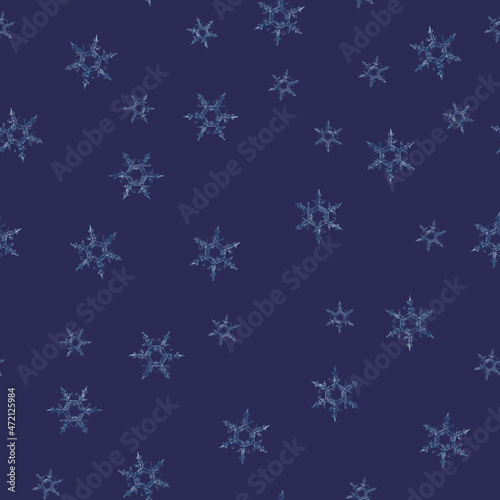 Microscope snowflakes on dark blue