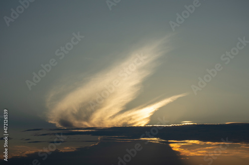 Landscape. The play of light. Sunny cloudy sky. Sunset
