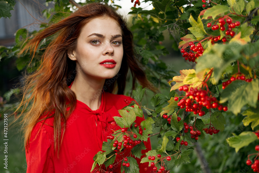 Woman in red shirt plants berries nature summer Woman in red shirt plants berries nature summer