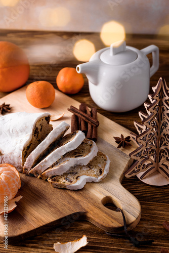 german christmas cake stollen with spices, tangerines and decor