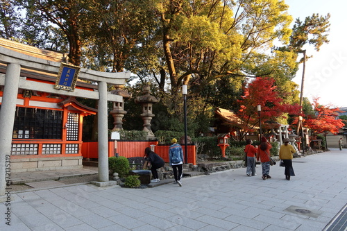  Subordinate Shrines and autumn leaves and cosmetic water in the precincts of Yasaka-jinja Shinto Shrine at Higashiyama in Kyoto City in Japan 日本の京都市東山にある八坂神社境内にある摂社群と紅葉と美容水 photo