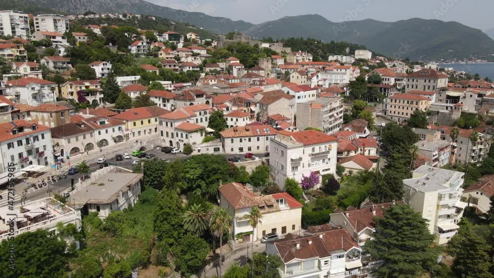 Herceg Novi Downtown, Montenegro. Aerial View, Hillside Buildings Above Adriatic Sea and Kotor Bay, Popular Holiday Destination, Drone Shot Herceg Novi Downtown, Montenegro. Aerial View, Hillside Buildings Above Adriatic Sea and Kotor Bay, Popular Holiday Destination, Drone Shot