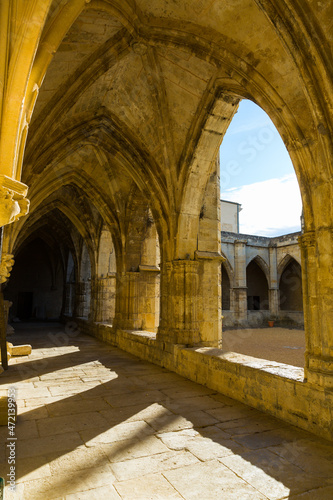Gallery with arches in courtyard of medieval Cathedral of Saint Nazaire, Beziers