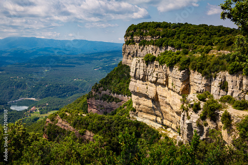 Picturesque rocky landscape of natural limestone cliffs near Spanish village of Tavertet on sunny summer day, Catalonia photo