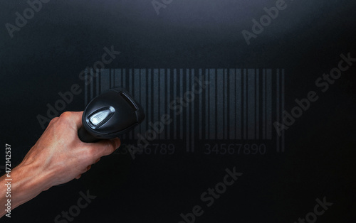 Barcode concept. Retail label barcode scan. Reader laser scanner for warehouse on black background. Warehouse inventory management.