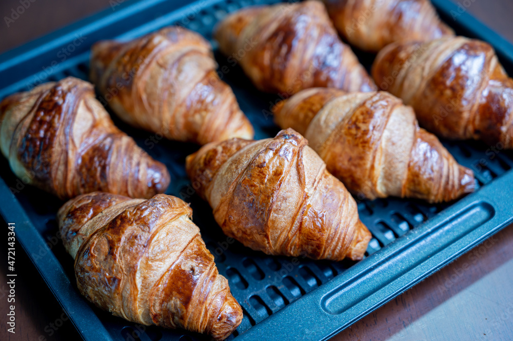 Homemade croissant. A croissant for breakfast cooked deliciously in a household oven Homemade croissant. A croissant for breakfast cooked deliciously in a household oven