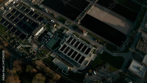 Dolly back pan up reveal shot of large water treatment plant photo