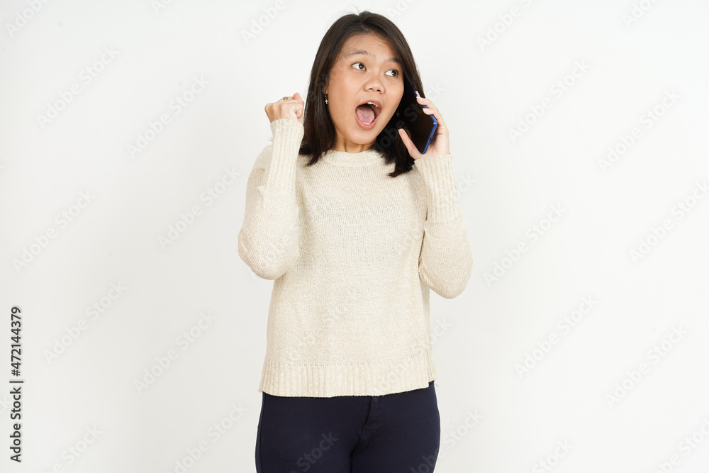 Talking on the phone and excited of Beautiful Asian Woman Isolated On White Background Talking on the phone and excited of Beautiful Asian Woman Isolated On White Background
