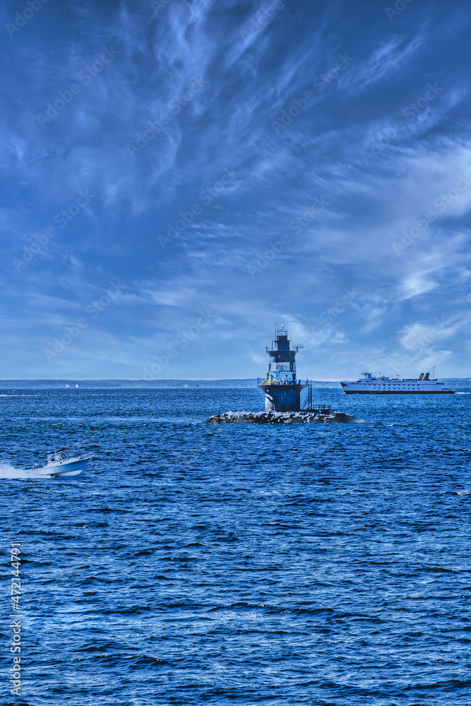 The lighthouse off Orient Point is situated on a small island in Long Island Sound The lighthouse off Orient Point is situated on a small island in Long Island Sound