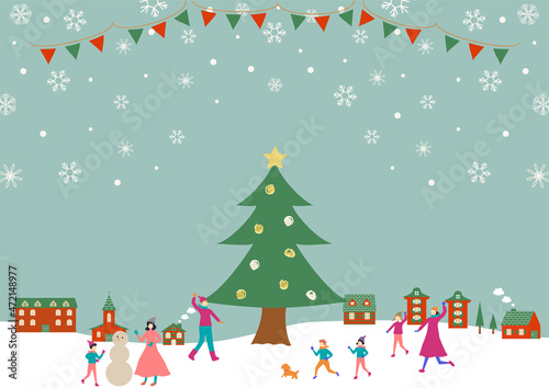 クリスマスツリーと人々　雪の風景