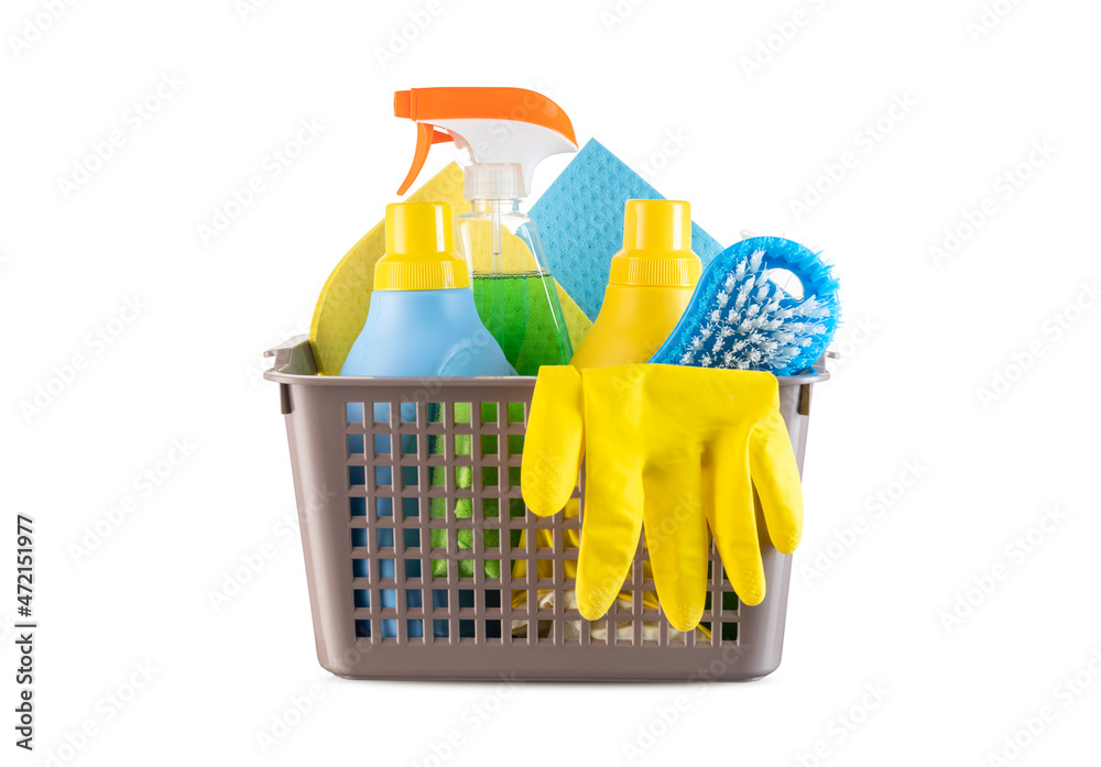 Basket with different cleaning products and tools on white background Basket with different cleaning products and tools on white background