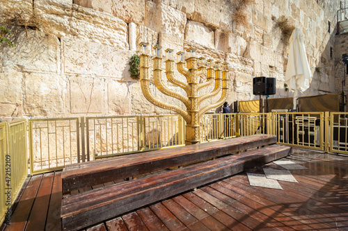 A wide-angle view of the huge and traditional golden menorah lying in the Western Wall plaza in Jerusalem
 photo