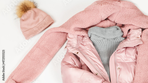 Women's warm winter clothing and accessories - jacket and hat. Fashion concept. Flat lay. Wish list or shopping overview concept