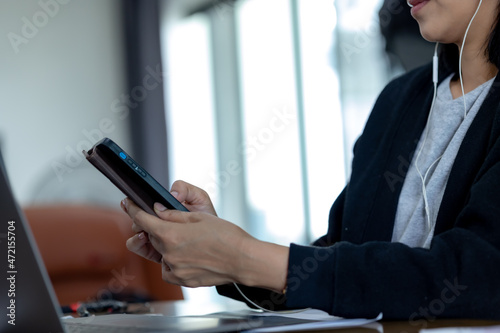 Close up businesswomen hands using smartphone 