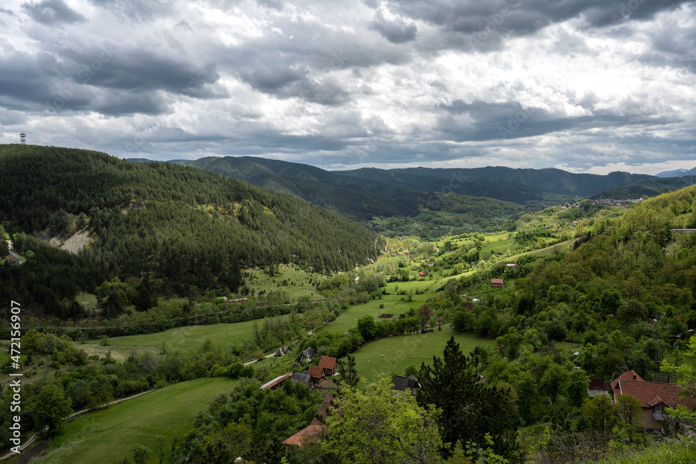 The natural landscape, the beauty and majesty of green meadows and forests. Top view. Rural house in field. Beautiful landscape photography of nature The natural landscape, the beauty and majesty of green meadows and forests. Top view. Rural house in field. Beautiful landscape photography of nature