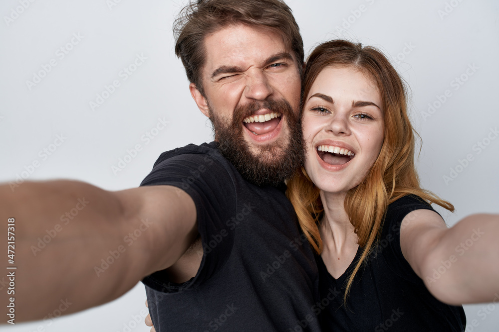 Man and woman hug communication friendship posing light background Man and woman hug communication friendship posing light background