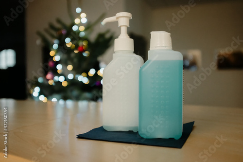 pump dispenser in the office with christmas tree in the back