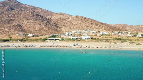 Ios island is located in the Cyclades group in the Aegean Sea. aerial drone view of magganari bay beach in ios island. luxury accommodation in greece Video photo