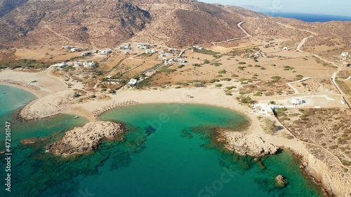 aerial drone view of village magganari bay beach in ios island. Ios island is located in the Cyclades group in the Aegean Sea. luxury accommodation in greece Video. photo