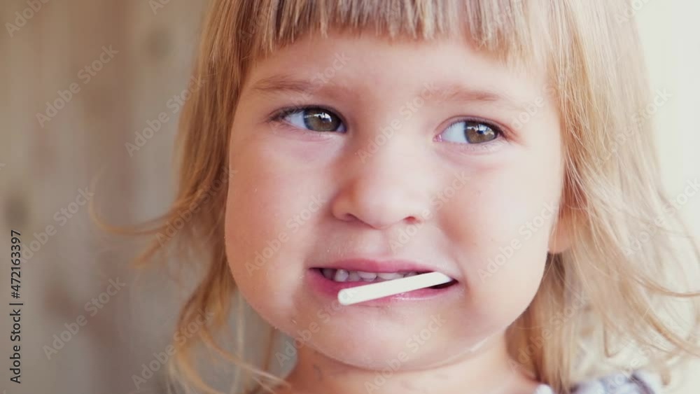 Pretty little girl with a bright lollipop. Studio shot Pretty little girl with a bright lollipop. Studio shot